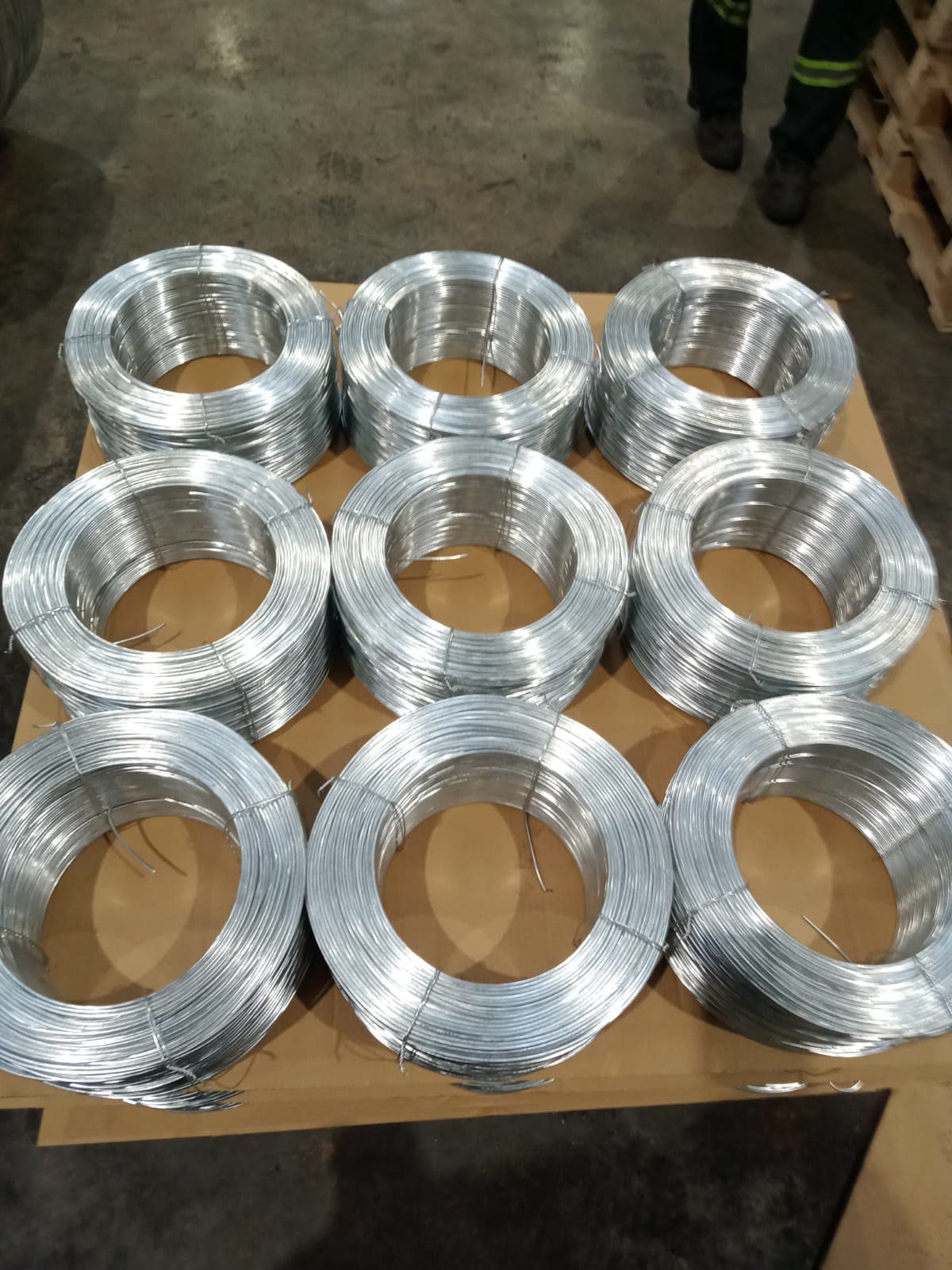 Galvanized baling wire coils arranged on a pallet