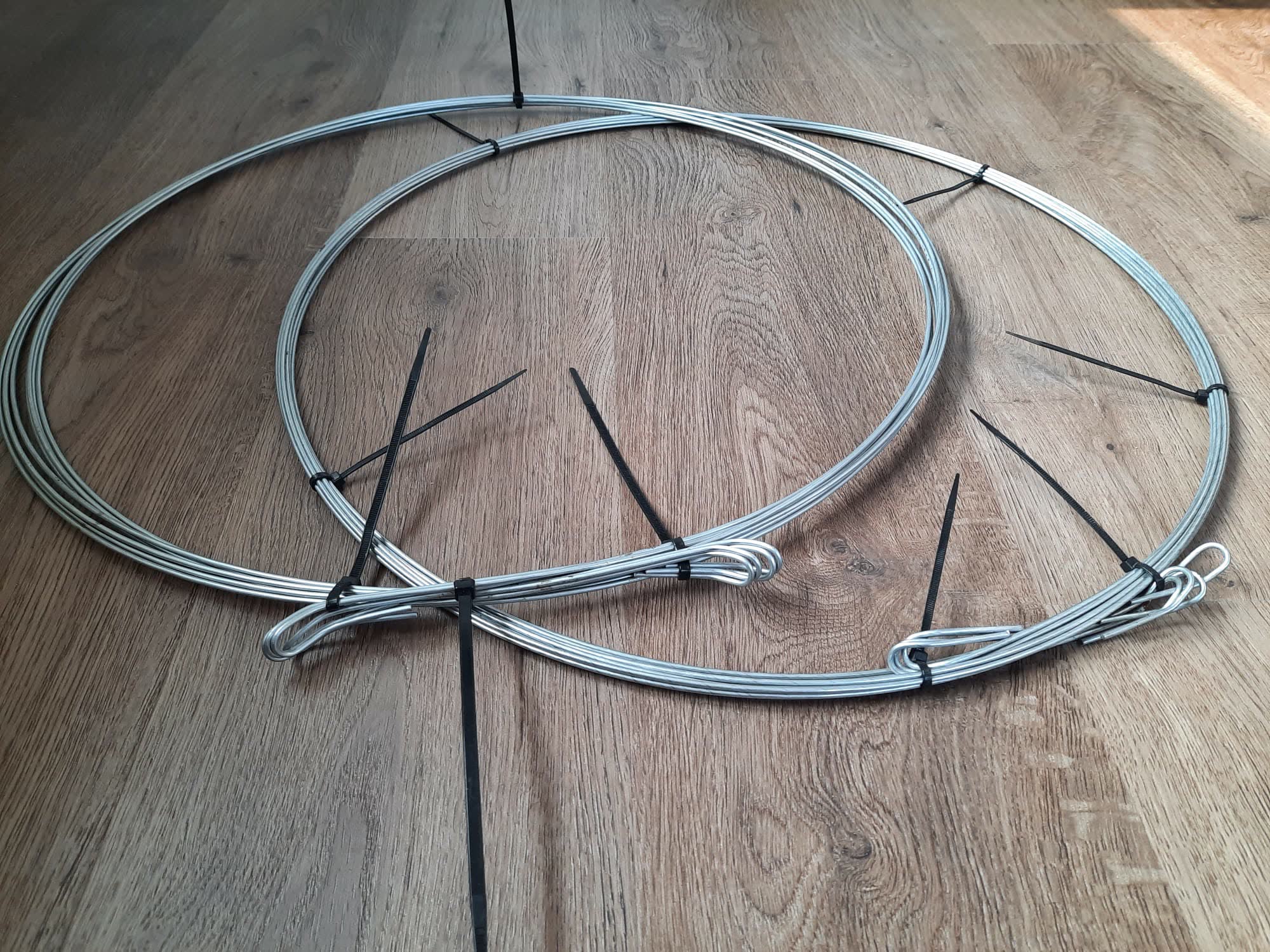 Two rolls of quick link bale ties laid out, ready for shipping